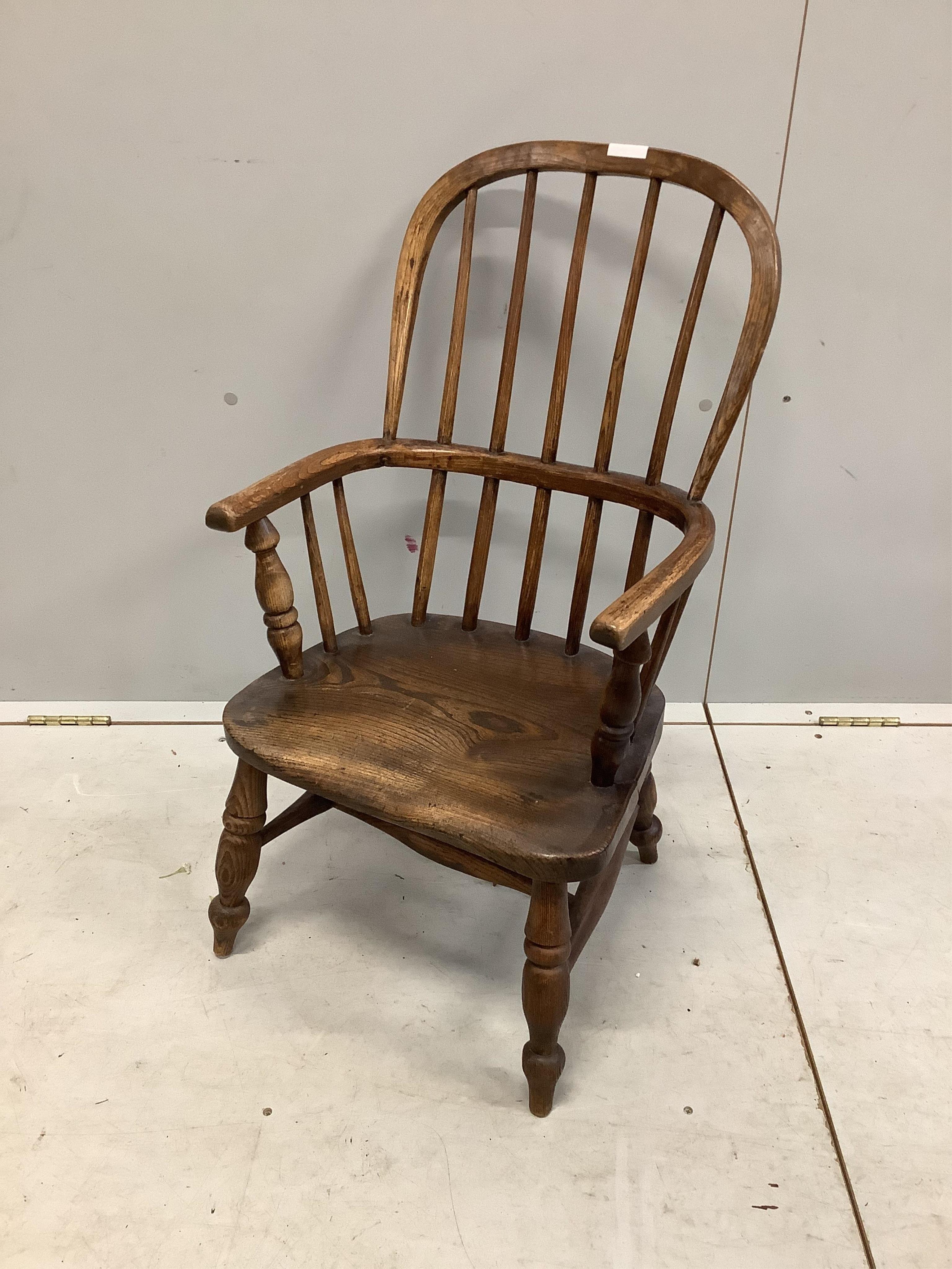 A 19th century ash and elm Windsor comb back child's chair, width 43cm, depth 32cm, height 77cm. Condition - fair